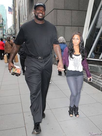 Shaquille and a small woman.